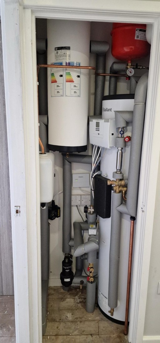 Internal plant room showing cylinder, buffer vessel and controls
