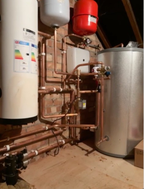 Loft plant room with cylinder, buffer vessel and copper pipework installed, Nassington
